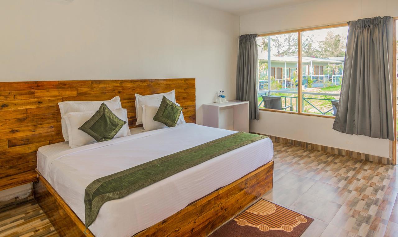 Treebo Lands End Beach Resort Морджим Экстерьер фото